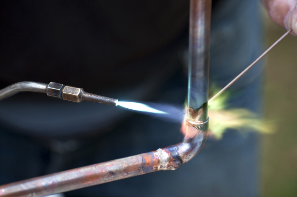 Flame brazing of a copper pipe joint